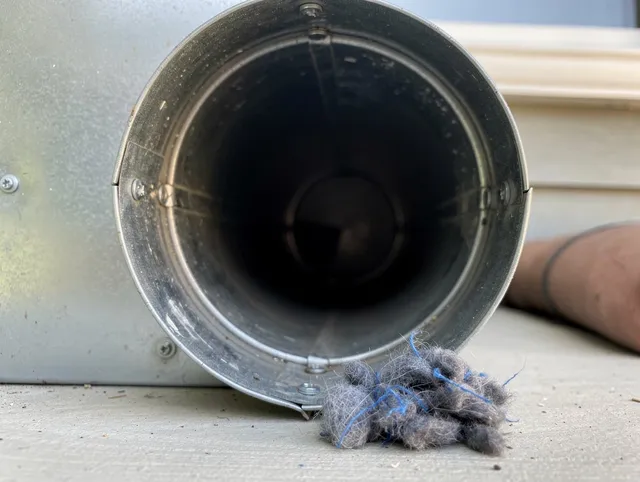 Gahanna Dryer Vent Cleaning technician using specialized equipment to clear severe dryer vent blockage in Gahanna